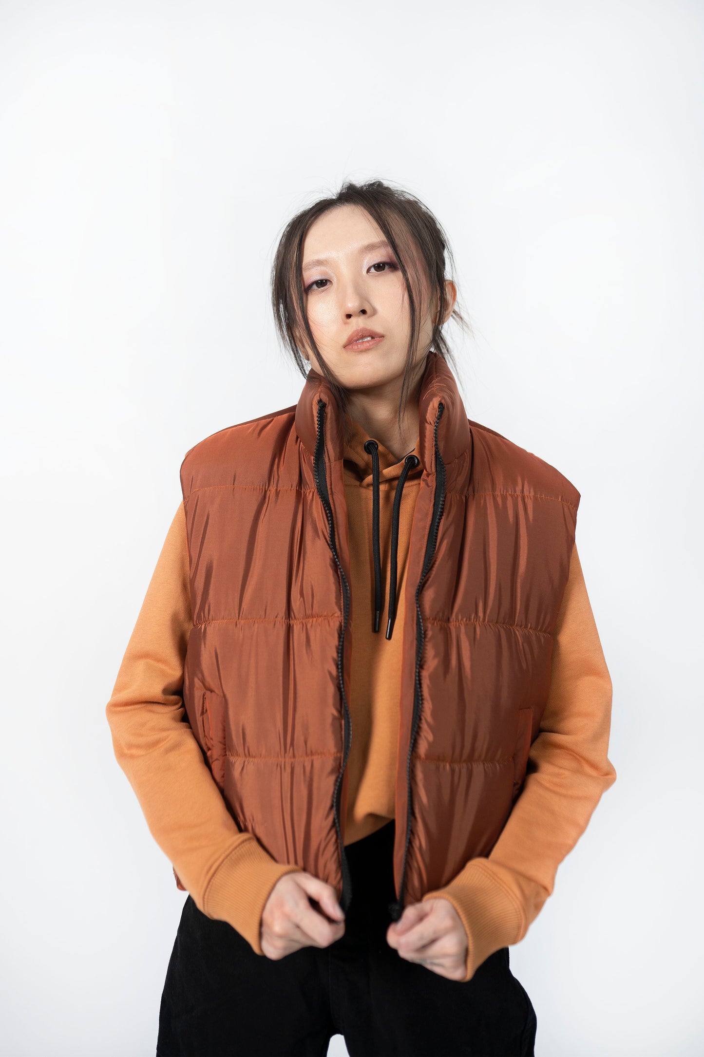 Sleeveless Puffer Jacket in Rust Orange