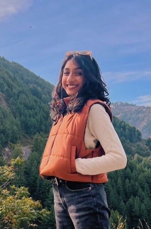Sleeveless Puffer Jacket in Rust Orange